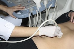man having ultrasound scan of a lump in London
