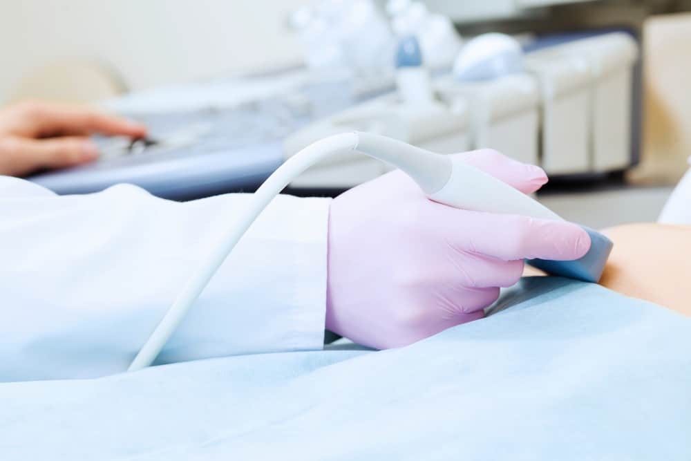 woman having a private ultrasound scan of a lump in London