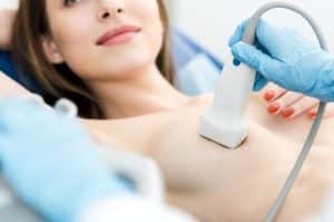 A woman having a breast ultrasound in a private clinic in London